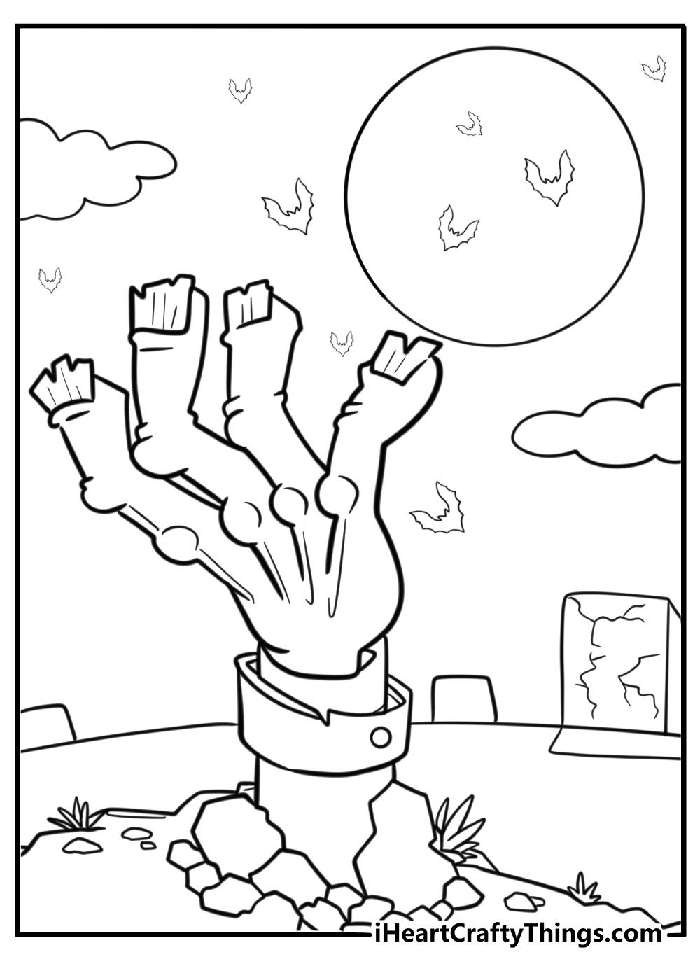Zombie hand reaching out from the ground at night